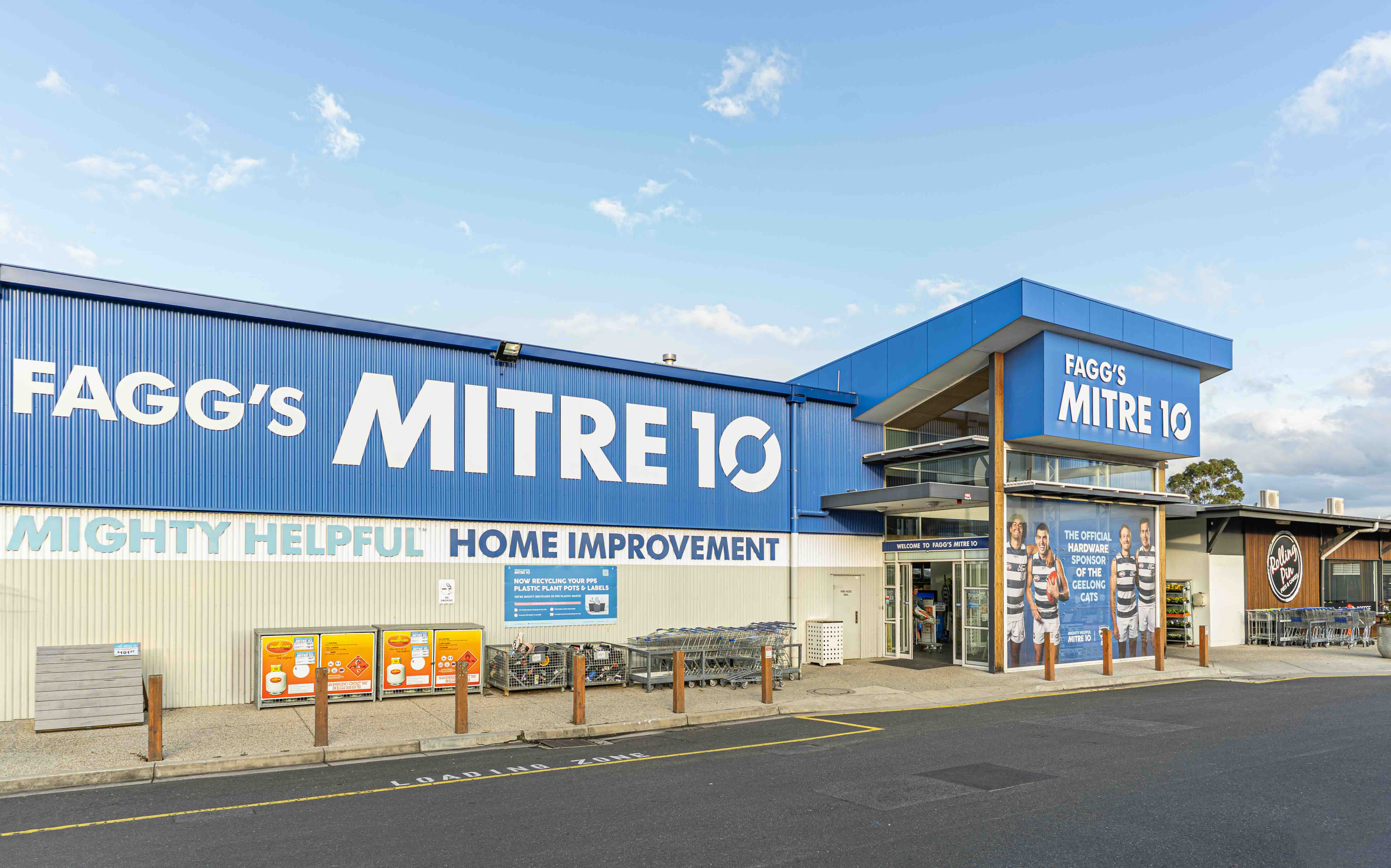 Exterior of Fagg's Mitre 10 hardware store with blue signage and shopping carts outside.
